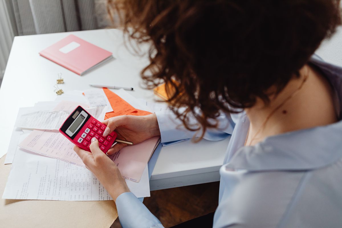 Calculator and paperwork representing common percentage calculations