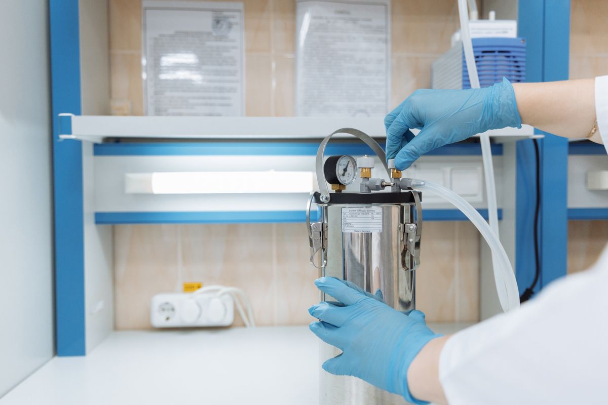 Scientist adjusting measurement equipment in a lab to compare observed and true values